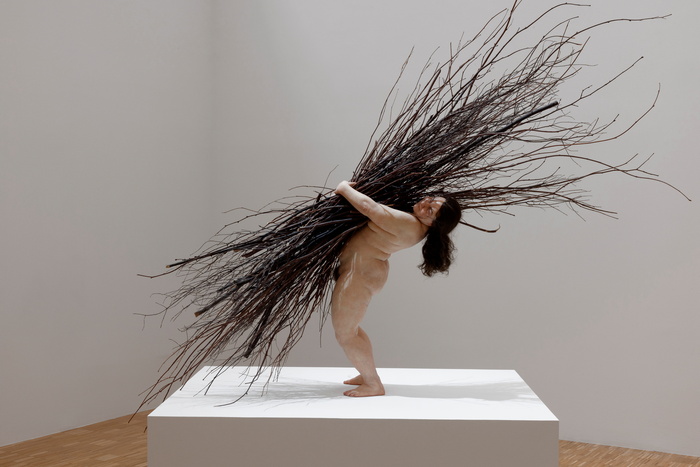 Woman with Sticks, 2009–10