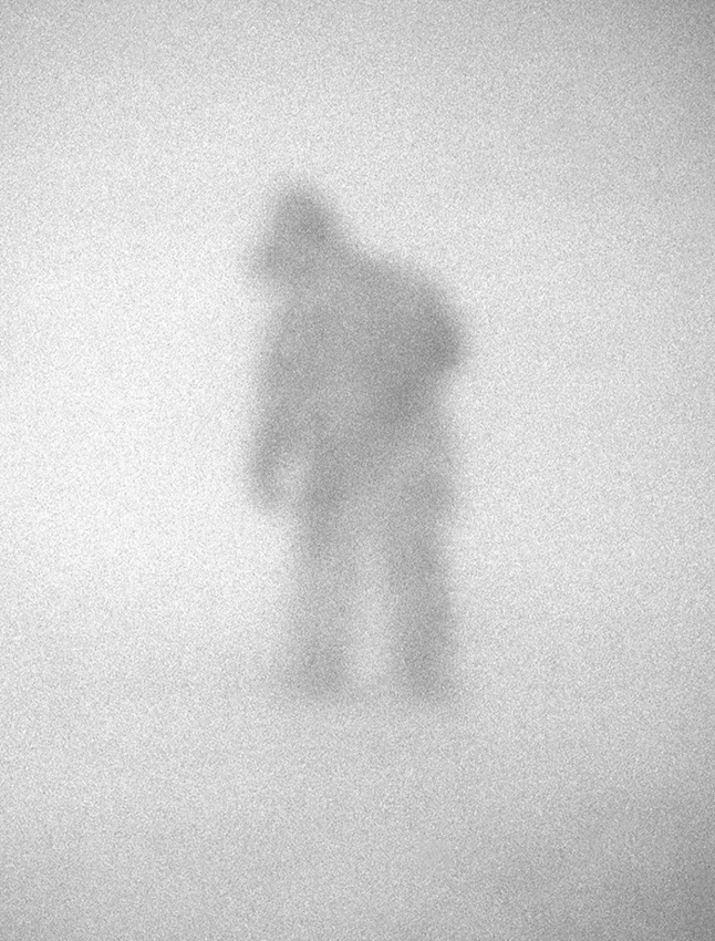 David Neilson, Cartographer Noel Ward inspecting dog line in blizzard, Mawson Station, East Antarctica, December 1990