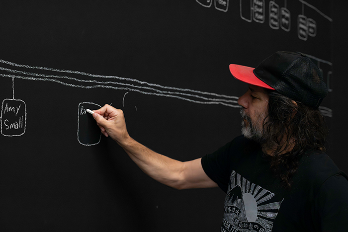 Artist Archie Moore creating kith and kin 2024 at the Gallery of Modern Art (GOMA)