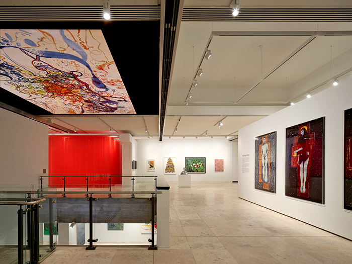 Installation view, Iconic Loved Unexpected, Newcastle Art Gallery, Australia, 2026, featuring (clockwise from above left) John Olsen, The sea sun of 5 bells, 1964; Dani Marti, Looking for Felix, 2000; Jemima Wyman, Mass monument (yellow and black), 2018; Tamara Dean, Sacred lotus (Nelumbo nucifera) in Summer, 2018; Savanhdary Vongpoothorn, Flesh, 2003; Julie Rrap, Persona and shadow: Christ, 1984; Julie Rrap, Persona and shadow: Madonna, 1984 / Photograph: Matt Carbone / © the artists